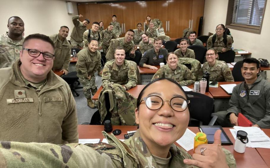 1st Lt Michelle Chang poses for a selfie with classmates and instructor at the conclusion of a Flight Commander Leadership Course at Osan Air Base, Republic of Korea, Dec. 7, 2022. Officers participated in the professional development opportunity for the chance to meet other company grade officers from across the installation and gain leadership lessons in this three-day course. (courtesy photo)