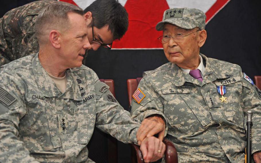 Gen. Paik, Sun-yup (left) pictured wearing his Eighth Army honorary commander field jacket Aug. 25, 2014. He is speaking with Lt. Gen. Bernard Champoux, then Eighth Army commanding general. (U.S. Army photo by Pfc. Suh, Eighth Army Public Affairs Office)