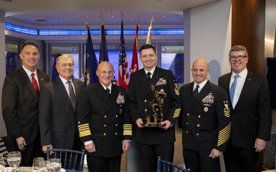 WASHINGTON (Nov. 20, 2019) - (From left) Retired Sgt. Maj. Lynn Kimble, retired MCPON Jim Herdt, Chief of Naval Operations (CNO) Adm. Mike Gilday, Command Master Chief Matt Lashley, Master Chief Petty Officer of the Navy (MCPON) Russ Smith, and retired Rear Adm. Frank Thorp pose for a photo at the inaugural Delbert D. Black Leadership Award Ceremony Dinner at the U.S. Navy Memorial. (U.S. Navy photo by Chief Mass Communication Specialist Nick Brown/Released)