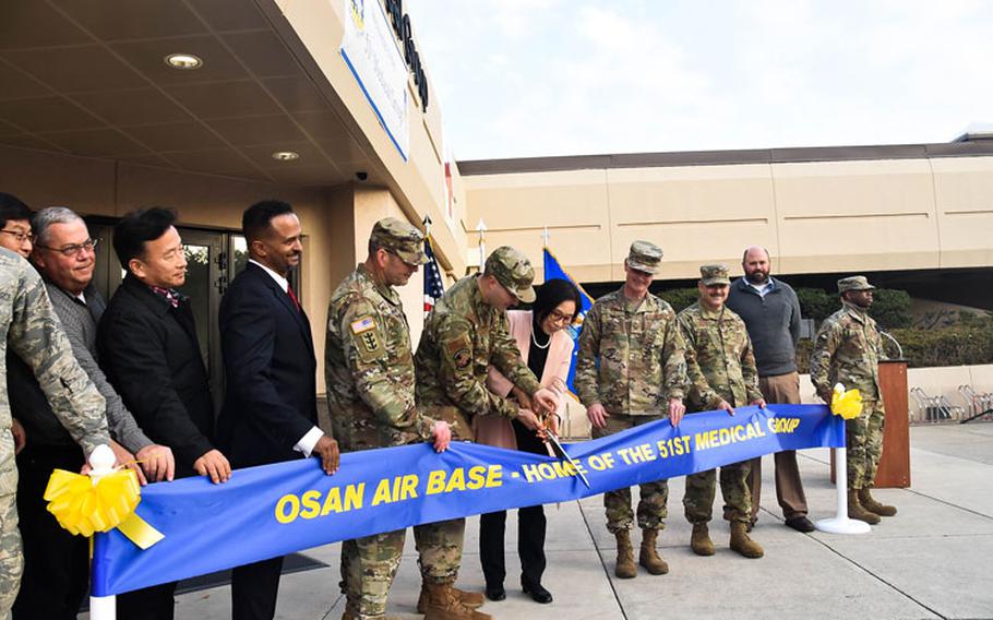 Col. Christopher Crary, U.S. Army Corps of Engineers (USACE), Far East District (FED) commander, along with other distinguished guests, participate in the 51st Medical Group Hospital expansion and renovation ribbon cutting ceremony, Osan Air Base, South Korea, Nov. 26.