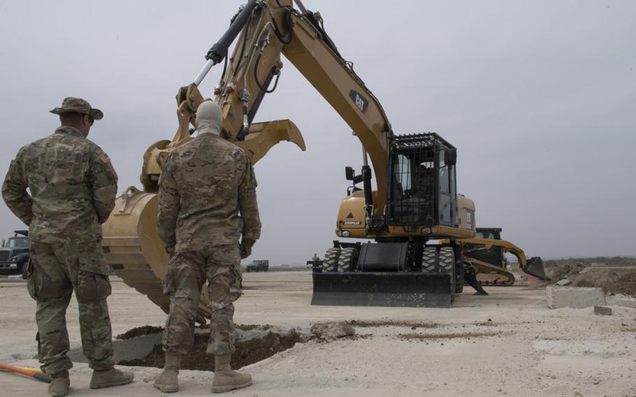 U.S. Airmen and Soldiers excavate a repair site during rapid airfield damage repair (RADR) training at Osan Air Base, Republic of Korea, April 19, 2019. RADR is a quick process used to repair structural damages on an airfield where civil engineers evaluate damages, prepare areas for repair and pour concrete to get the airfield back to mission ready. (U.S. Air Force photo by Staff Sgt. Ramon A. Adelan)