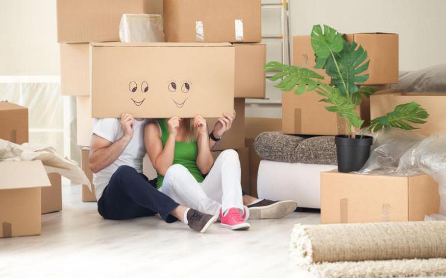 People holding up decorated empty boxes