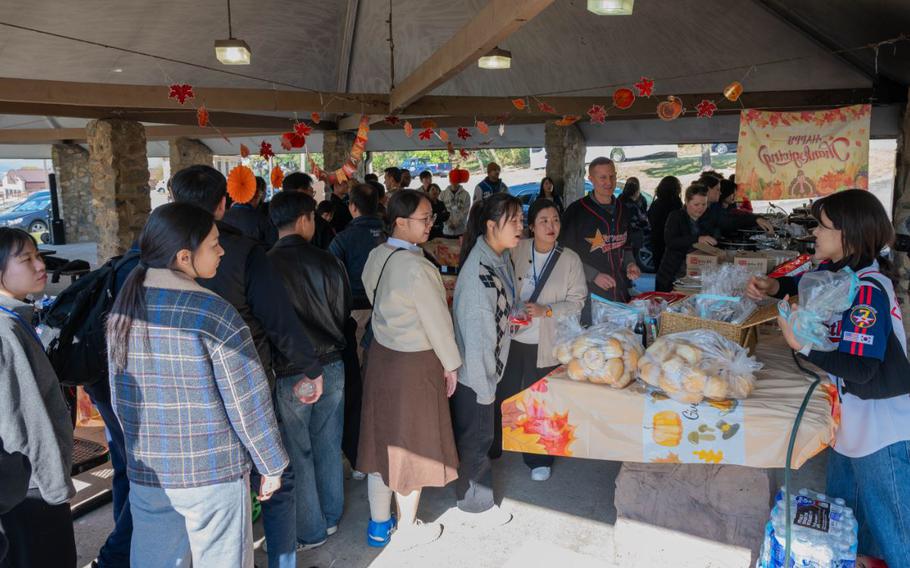 U.S. Air Force and Republic of Korea Air Force paralegal teams gather for lunch during the annual legal friendship day at Osan Air Base.