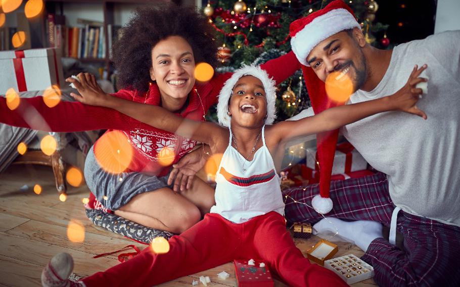 Happy family have fun together at Christmas morning