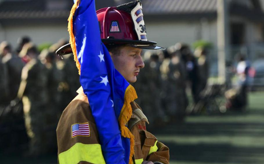 An 8th Civil Engineer Squadron honor guard member carries the U.S. Air Force flag during a 9/11 remembrance ceremony at Kunsan Air Base, Republic of Korea, Sept. 8, 2022. Each year, the 8th Fighter Wing reflects on the tragic events that occured on Sept. 11, 2001 and pays tribute to all the lives lost that day. (U.S. Air Force photo by Staff Sgt. Isaiah J. Soliz)