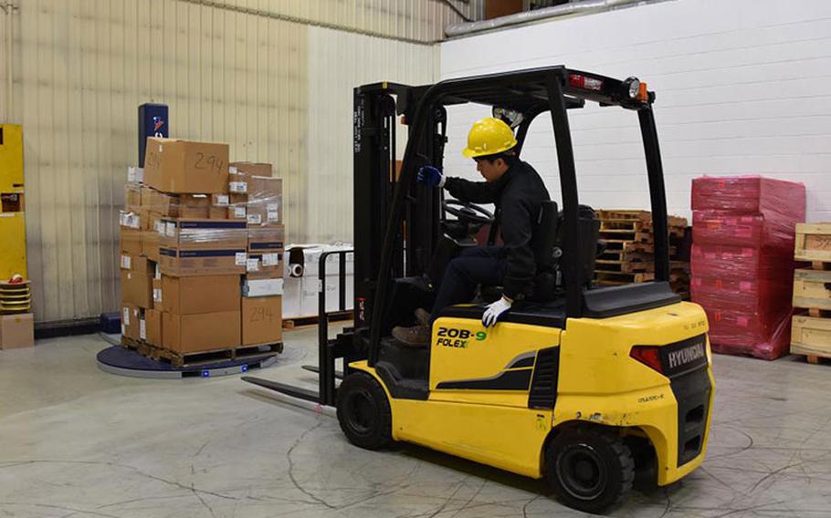 A worker in the U.S. Army Medical Materiel Center-Korea distribution warehouse prepares a pallet of medical materiel for delivery to a customer. USAMMC-K was recently recognized for its strong safety culture with the U.S. Army Safety Excellence Streamer, which requires zero incidents in the past 12 months and 100% participation in required risk management training.