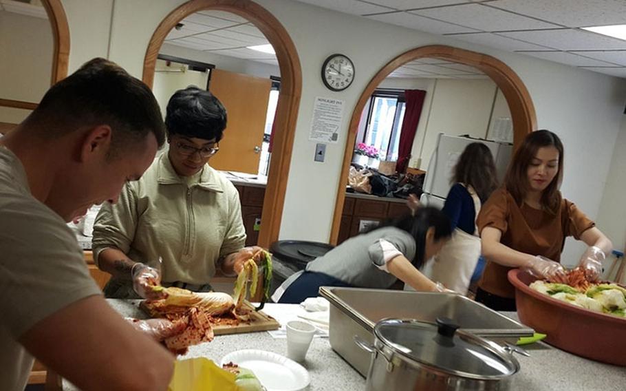 Kunsan Air Base, Republic of Korea, personnel and Korean nationals take part in a kimchi making class organized by the 8th Force Support Squadron. (courtesy photo)