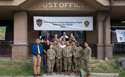 Photo Of Personnel assigned to the 51st Force Support Squadron Post Office pose for a photo at Osan Air Base, Republic of Korea.