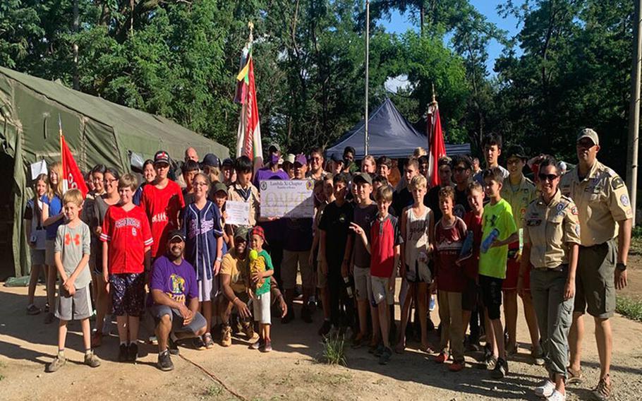 Group photo of Scouts, staff, and supporters upon completion of the 2nd Annual Scouts (BSA) Tiger Merit Badge University on Friday, July 1, 2022.  Donations were made by local VFW Posts and the Lambda Xi Chapter of the Omega Psi Phi Fraternity, Inc.  These organizations consistently support Tiger MBU.  Additional logistics and life support requirements were supported by 8th Army and the 8th Army Headquarters Support Company. (Photos courtesy of Boy Scouts of America)