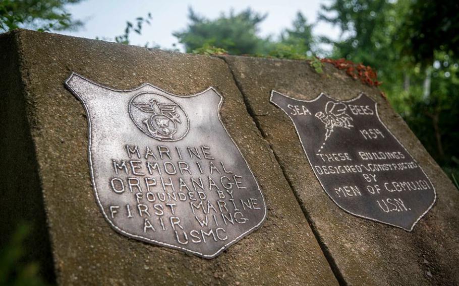 Plaques placed by 1st Marine Air Wing and Seabees with Naval Construction Maintenance Unit 101 mark the original building site of the Sunrin Aeyukwon Children’s Home in Pohang, South Korea.