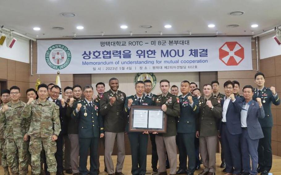 Eighth Army Headquarters and Headquarters Battalion commander, Lt. Col Joshua Pusillo, and the Pyeongtaek University Reserve Officers' Training Corps cadet commander, Lt. Col. Jun-gi Baek, signed a memorandum of understanding earlier this month. Courtesy Photo