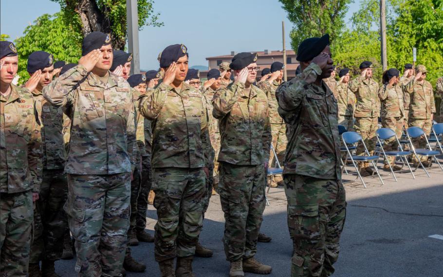 Members of the 51st Security Forces Squadron stand and salute during the police week opening ceremony, 9 May, 2022, at Osan Air Base, Republic of Korea. The events of police week are meant to honor the men, women and canines of the law enforcement community that are currently serving and those that have given their lives in the line of duty. (U.S. Air Force photo by Staff Sgt. Skyler Combs)