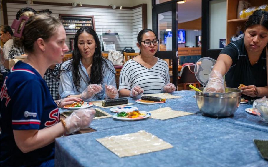 Osan Air Base spouses participate in a Kimbap making class during Spouse Appreciation Day at Osan AB, Republic of Korea, May 10, 2024. 