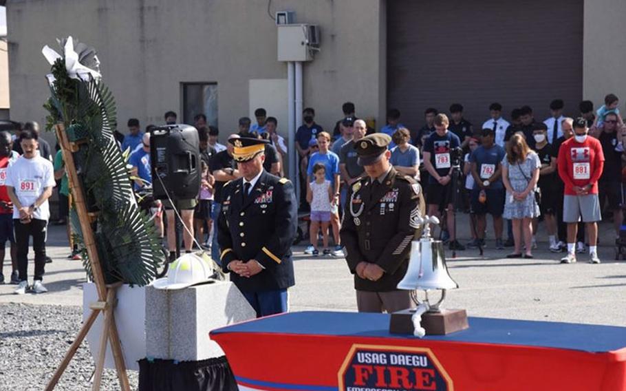 USAG Daegu Commander Col. Brian P. Schoellhorn and Command Sgt. Maj. Jonathon J. Blue led a wreath-laying ceremony and saluted in front of a makeshift 9/11 memorial—on the 20th anniversary of 9/11—to honor and remember the memories of those lost on 9/11 and all the patriots and their families who have sacrificed in defense of freedom. (U.S. Army)