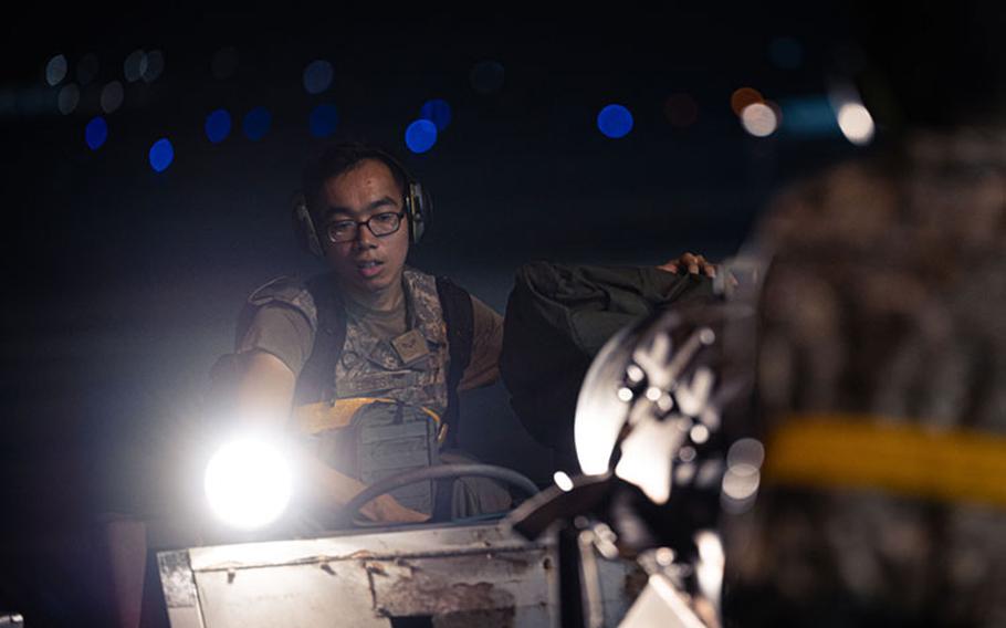 Airman 1st Class Shawn Edles, 80th Fighter Generation Squadron aircraft armament systems journeyman, uses a loader vehicle to move munitions while preparing an F-16 Fighting Falcon for flight operations during Beverly Pack 23-3 at Kunsan Air Base, Republic of Korea, Sept. 17, 2023. Airmen from multiple squadrons participated in a base-wide exercise, generating multiple aircraft and testing their rapid response capabilities. (U.S. Air Force photo by Staff Sgt. Jovan Banks)