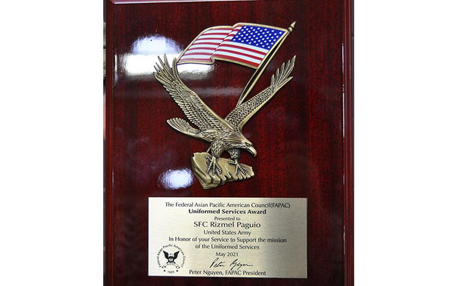 A close-up view of the award presented May 26 to Sgt. 1st Class Rizmel Paguio. Paguio, a member of the 563rd Medical Logistics Company at the U.S. Army Medical Materiel Center-Korea, was one of 10 winners of the 2021 Uniformed Services Award presented by the Federal Asian Pacific American Council. (U.S. Army photo by Paek Hye-chin)