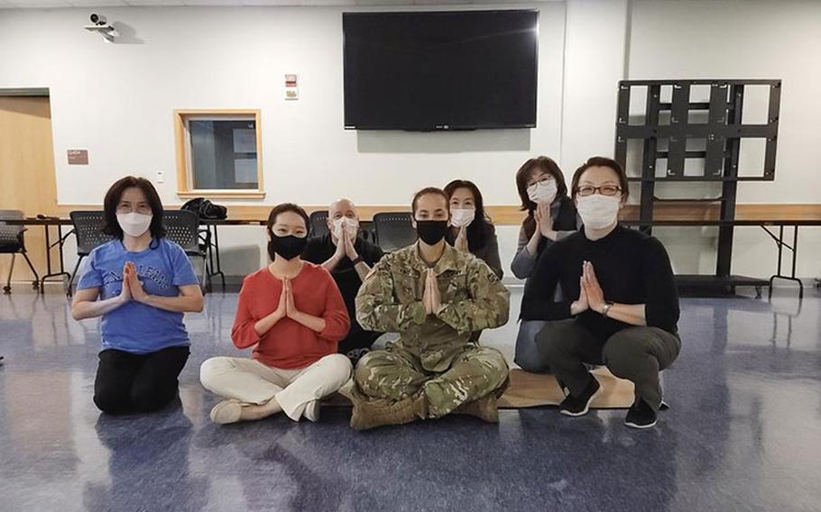 Far East District personnel participate in a Free Breathing, Meditation Yoga Class, at FED headquarters, March 7. This year’s theme “Providing Healing and Promoting Hope,” pays tribute to the ceaseless work of caregivers and recognizes the thousands of ways that women of all cultures have provided both healing and hope throughout history. (U.S. Army photo by An Yo-han)