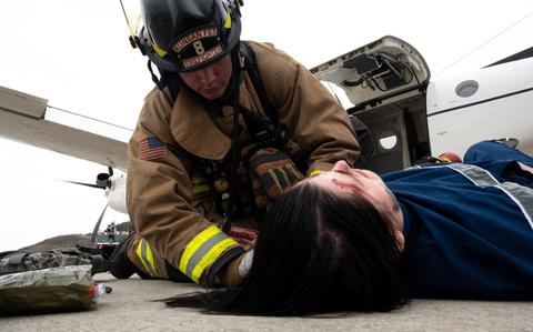 Photo Of A firefighter from the 8th Civil Engineer Squadron attends to a simulated victim during a mass accident response exercise at Kunsan Air Base, Republic of Korea, April 4, 2024.