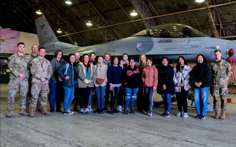 Spouses from the 51st Fighter Wing pose for a photo during a spouse tour at Osan Air Base, Republic of Korea, March 20, 2024.
