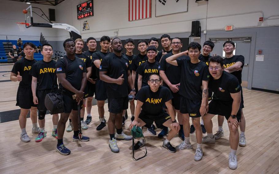 U.S. Soldiers and Korean Augmentation for the U.S. Army (KATUSA) assigned to Headquarters and Headquarters Company, U.S. Army Garrison Yongsan-Casey pose for a group photo during the 2025 KATUSA Friendship Week at Camp Casey, South Korea.