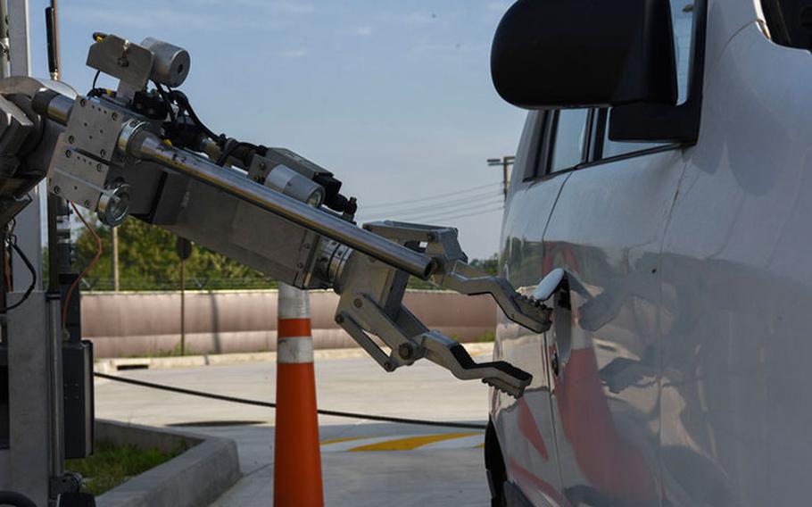 U.S. Air Force Senior Airman Jermey Hoban, 8th Civil Engineer Squadron explosive ordnance disposal team member, operates the EOD robot to open the vehicle’s doors during routine training at Kunsan Air Base, Republic of Korea, May 27, 2020. Hoban remotely operated the robot to open all of the doors and inspect the vehicle for additional threats. (U.S. Air Force photo by Senior Airman Jessica Blair)