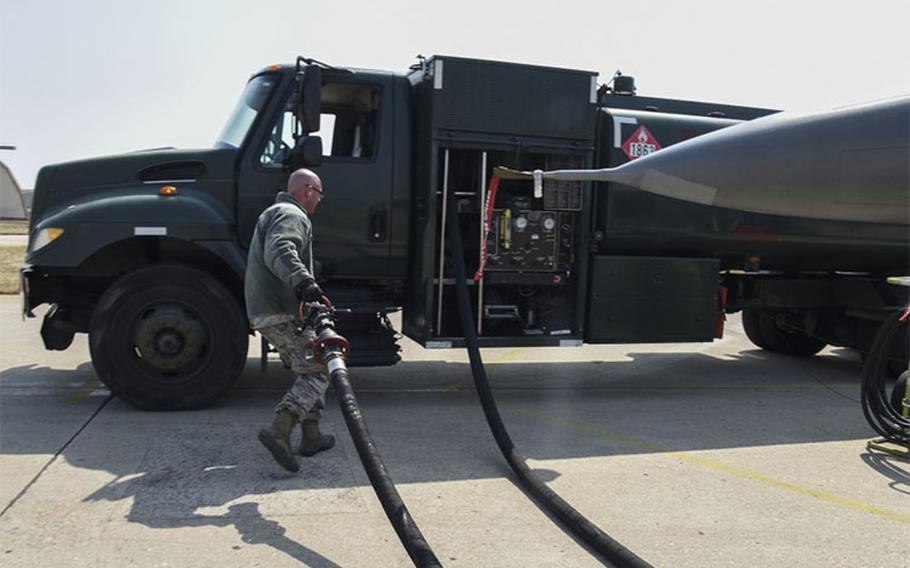 U.S. Air Force Tech. Sgt. Kevin Neiferd, 8th Logistics Readiness Squadron fuels distribution NCO in charge, puts away a hose after refueling an F-16 Fighting Falcon aircraft at Kunsan Air Base, Republic of Korea, April 3, 2020. The 8th LRS fuels management flight’s mission is to verify the quality of all fuel that comes in and out of the base to ensure the 8th Fighter Wing is always mission ready. (U.S. Air Force photo by Senior Airman Jessica Blair)