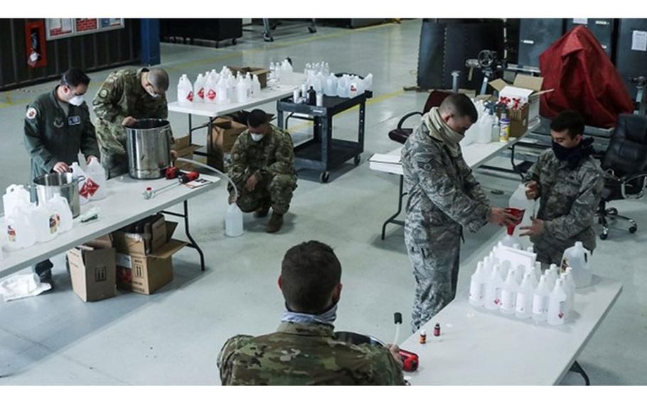 Airmen work together to create hand sanitizer at Dyess Air Force Base, Texas, April 6, 2020. The Airman were able to gather all of the hand sanitizer ingredients from locations on base and in the local community. (U.S. Air Force photo by Staff Sgt. David Owsianka)