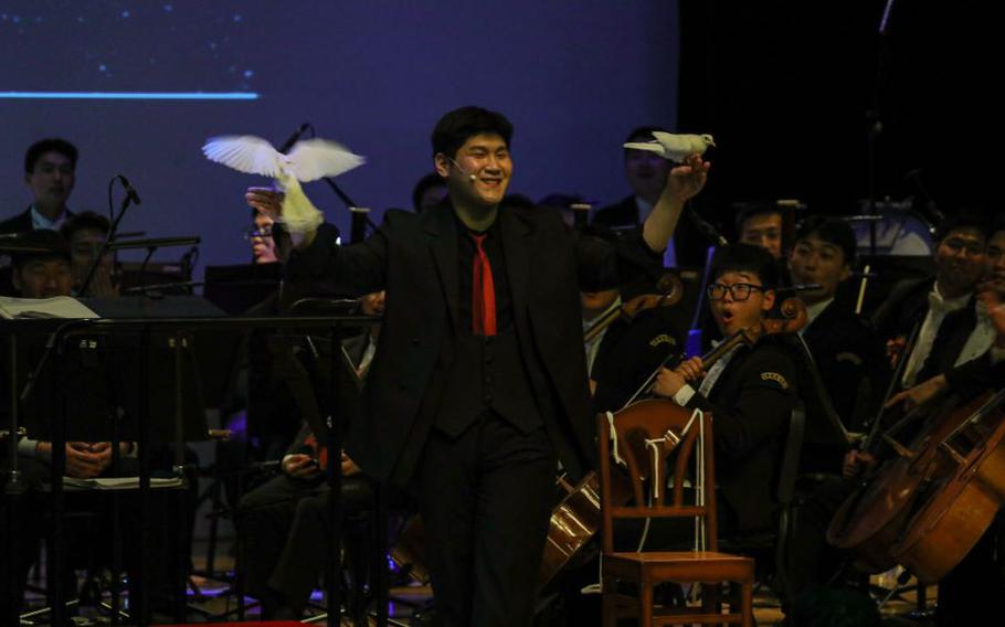 Magician, Corporal Kim, Gi Ryang entertains guest with magic tricks.