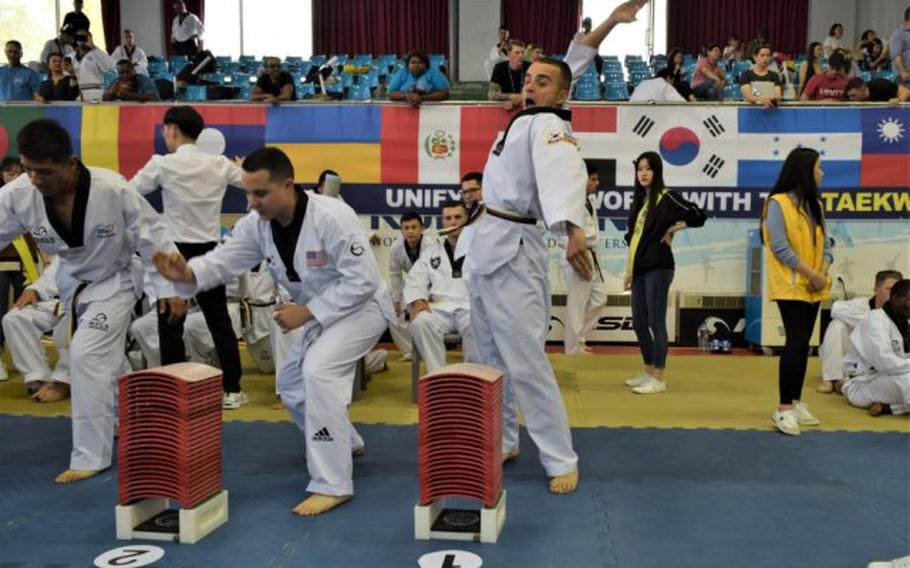 Spc. Omead Saney prepares to strike some boards at the 2019 Foreigners Taekwondo Culture Festival at Kukkiwon Taekwondo Headquarters in Gangnam, Seoul, South Korea, Sept. 28. Saney helped represent 2nd Infantry Division/Republic of Korea-U.S. Combined Division. (Photo Credit: Kenji Thuloweit)