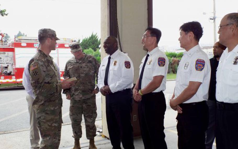 USAG Daegu commander, Col. Edward J. Ballanco presents members of the Fire and Emergency Services Division with the 2018 Department of Defense Fire Prevention Program of the Year Award for the U.S. Army. (Photo Credit: Laurel Stone, USAG Daegu Public Affairs)