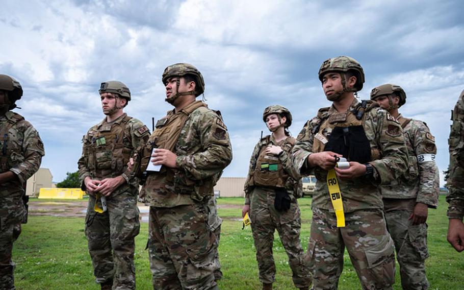 8th Security Forces Squadron Airmen stand by and await instructions during an integrated friendly forces training event as a part of Beverly Sentinel 23-2 at Kunsan Air Base, Republic of Korea, July 11, 2023. 8th Security Forces Squadron Airmen collaborated with local ROKAF counterparts to strengthen both nations’ ability to recognize friendly forces and properly communicate that to an installation entry controller. (U.S. Air Force photo by Staff Sgt. Jovan Banks)