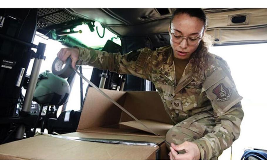 U.S. Air Force Tech. Sgt. Alexandra Vidato, 459th Airlift Squadron instructor flight engineer, tapes a box of simulated humanitarian aid prior to takeoff for a Tokyo Metropolitan Government-hosted disaster preparedness and response drill at Tokyo Rinkai Disaster Prevention Park, Japan, Sept. 3, 2022. (Photo: U.S. Air Force Tech. Sgt. Joshua Edwards, 374th Airlift Wing Public Affairs)