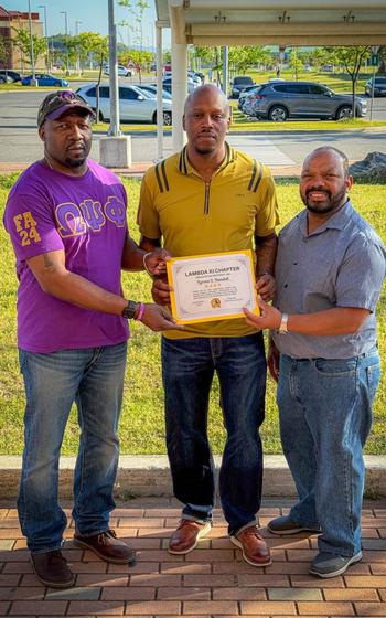Lambda Xi Chapter Social Action Chairman Bro. Marcus Shepard and Bro. Michael Robinson presenting certificate of appreciation to guest speaker Mr. Tyronne Randall, who is also a member of Mu Phi Lambda Chapter of Alpha Phi Alpha Fraternity, Inc.