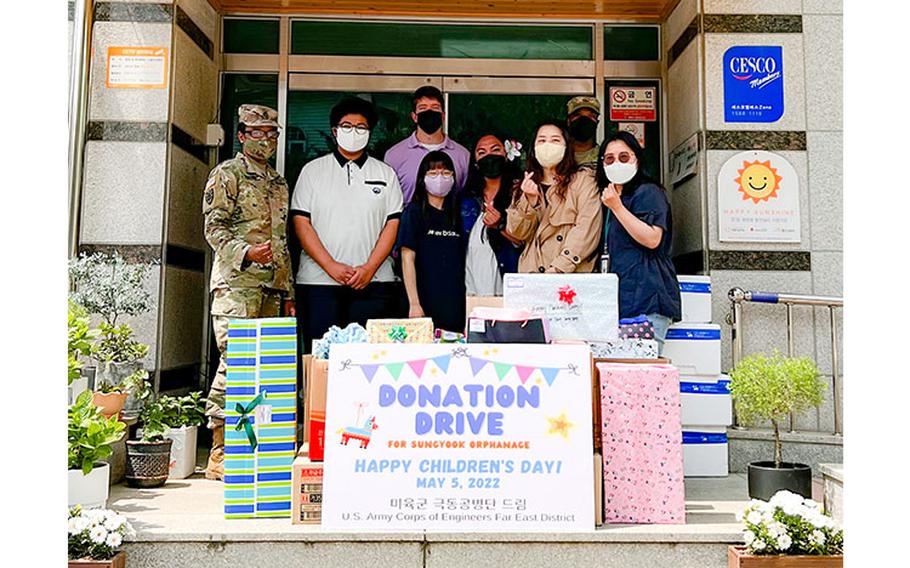 Volunteers from the U.S. Army Corps of Engineers Far East District pose for a group photo with the manager, student representatives, and gifts for the Sungyook Orphanage in Pyeongtaek, South Korea, May 5. (U.S. Army photo by Yohan An)