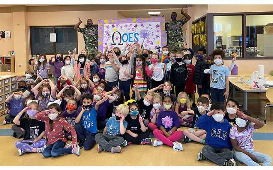 Mr. Chris O’ Sullivan and Mr. London Brown of Lambda Xi Chapter with kindergarten students at Osan Elementary School on Monday, April 18, 2022.