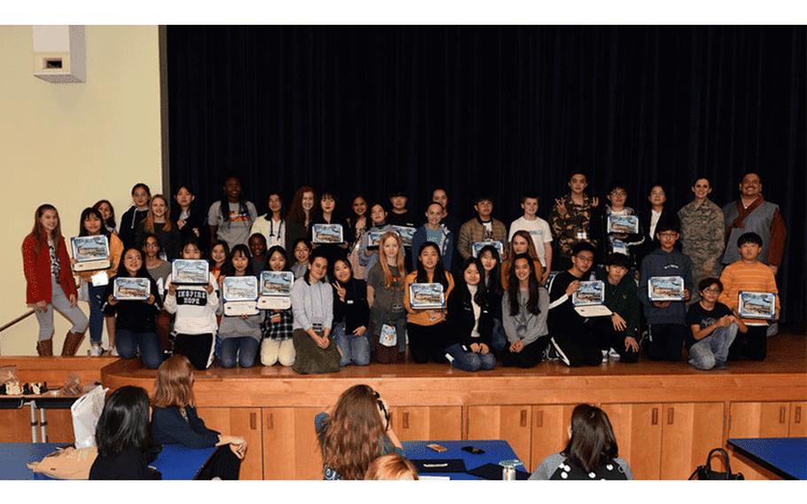 Middle school students from Pyeongtaek City and Osan Middle High School pose for a group photo at Osan Air Base, Republic of Korea, March 28, 2019. The students graduated from Osan’s English Camp, where Korean students are paired with U.S. counterparts, live with their families, experience American classes and tour the base, as part of the U.S. Forces Korea Good Neighbor Program. (U.S. Air Force photo by Staff Sgt. Sergio A. Gamboa)