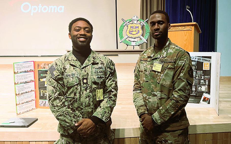 Members of Lambda Xi Chapter of the Omega Psi Phi Fraternity, Inc. LCDR Shawn Stanley, Cyberspace Operations – Integrated Planning Element, Defensive Cyberspace, Operations Lead, USCYBERCOM, stationed at Camp Humphreys and TSgt London Brown, Logistics Planner, Pacific Air Forces, stationed at Osan Air Base.