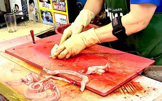 filleting an eel at Haeundae Market