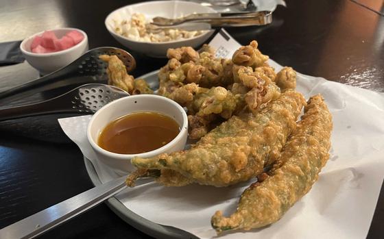 Fried Chicken gizzards fried stuffed green peppers, and spicy mustard sauce at Kyochon Pilbang, Seoul, South Korea.