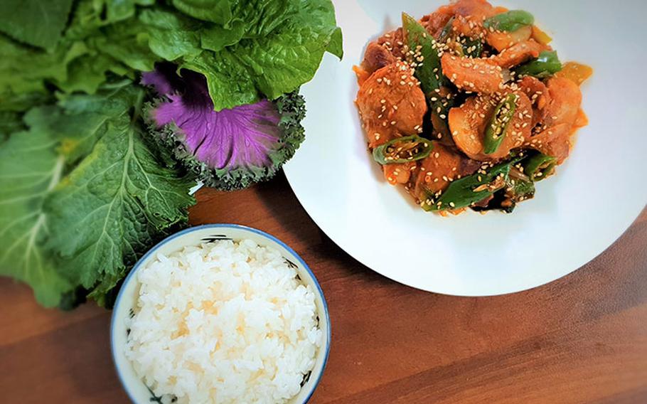 the pork  bbq dish and rice on the table.