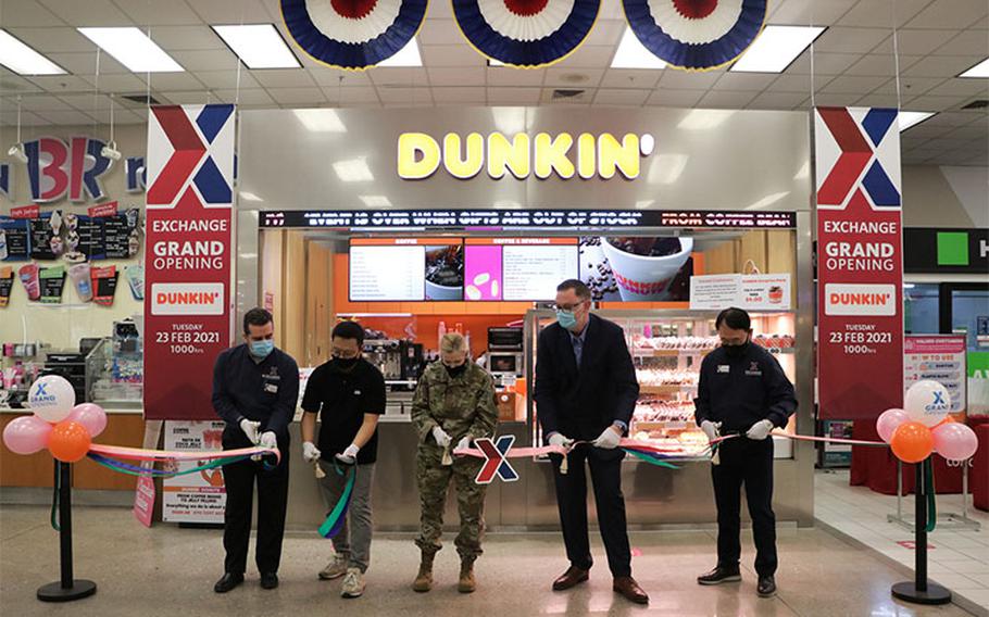 (From) Exchange General Manager Boris Nasci; Yang, Kyong-sok, Dunkin’ store owner; Col. Jonelle Eychner, 51st Mission Support Group commander; Scott Bonner, Exchange regional vice president; and Pak, Kye-hwan cut the ribbon on the new Dunkin’ Donuts at the Osan Air Base Exchange. (AAFES Photo by Kim, Ung-chol)