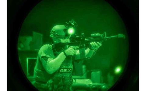 Photo Of U.S. Air Force Airman 1st Class Tylor Chism, 51st Security Forces Squadron Airman, engages simulated opposing forces during Ulchi Freedom Shield 24, at Osan Air Base, Republic of Korea.