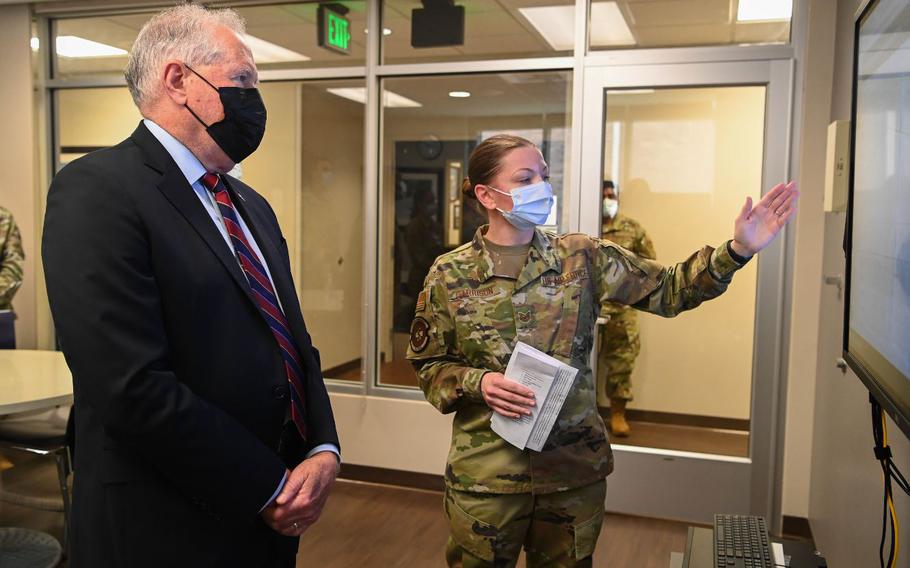 Secretary of the Air Force Frank Kendall is briefed about PTSD Awareness Month and the Learning and Engagement System, or LENS, from Tech Sgt. Jennifer Garrison, 316th Operational Medical Readiness Squadron mental health noncommissioned officer in charge, during a visit to Joint Base Andrews, Md., June 24, 2022. LENS is a tool that enables ready, reliable care and a new method of communication between providers and patients. (U.S. Air Force photos by Airman 1st Class Isabelle Churchill)