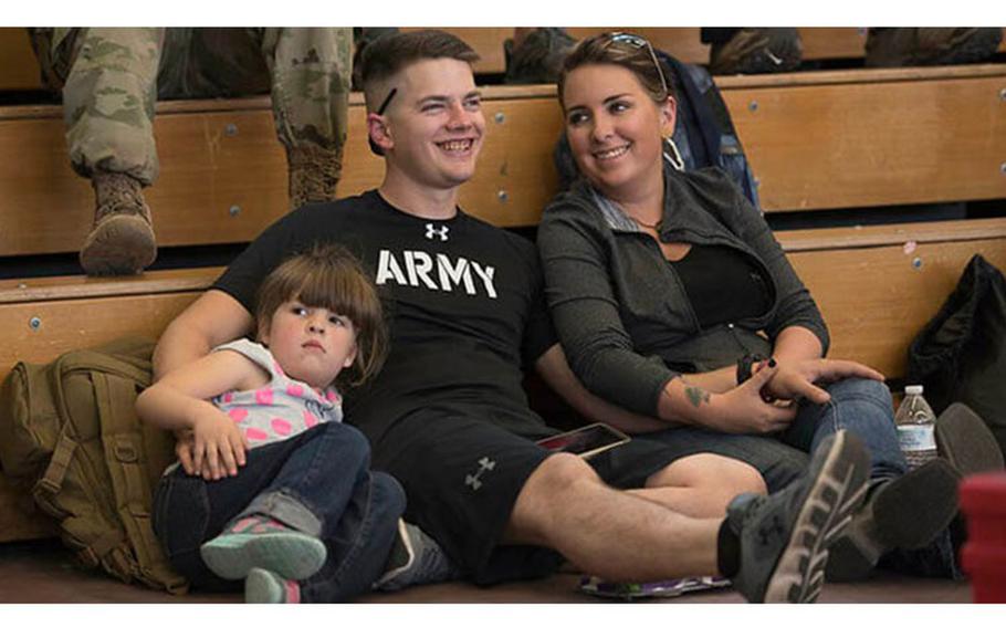 A participant and his family watch as wounded, ill and injured service members participate in the air rifle and air pistol competitions during the 2017 Army Warrior Games Trials at Fort Bliss, Texas (Department of Defense photo by Roger Wollenberg).