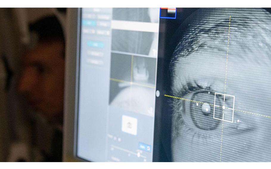 Capt. Dominic Rentz, 15th Operational Medical Readiness Squadron optometrist, demonstrates the new retinal camera at the optometry clinic at Joint Base Pearl Harbor-Hickam, Hawaii, June 16, 2022. Optometry technicians aid in the diagnosis of eye disorders while also playing an integral part in helping patients with their eye health. (Credit: U.S. Air Force Airman 1st Class Makensie Cooper)