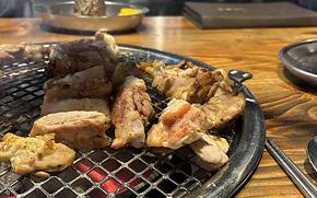 Chicken is being grilled.
