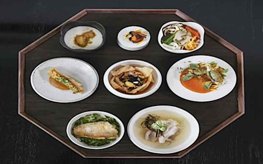 Eight dishes on a tray.