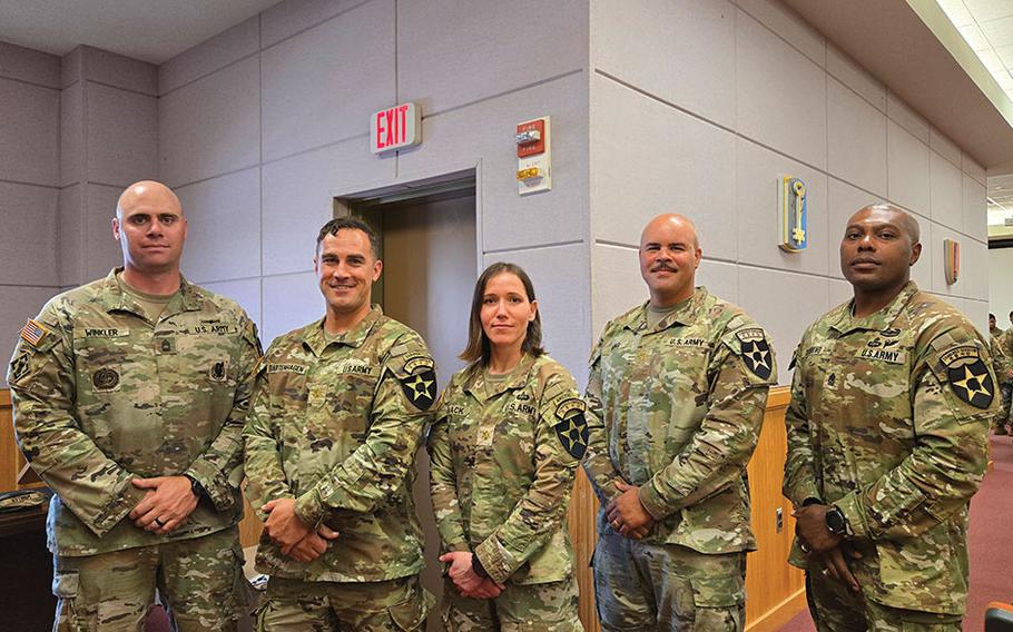 Maj. Mack and others from the 2nd Infantry Division pose for a photo.