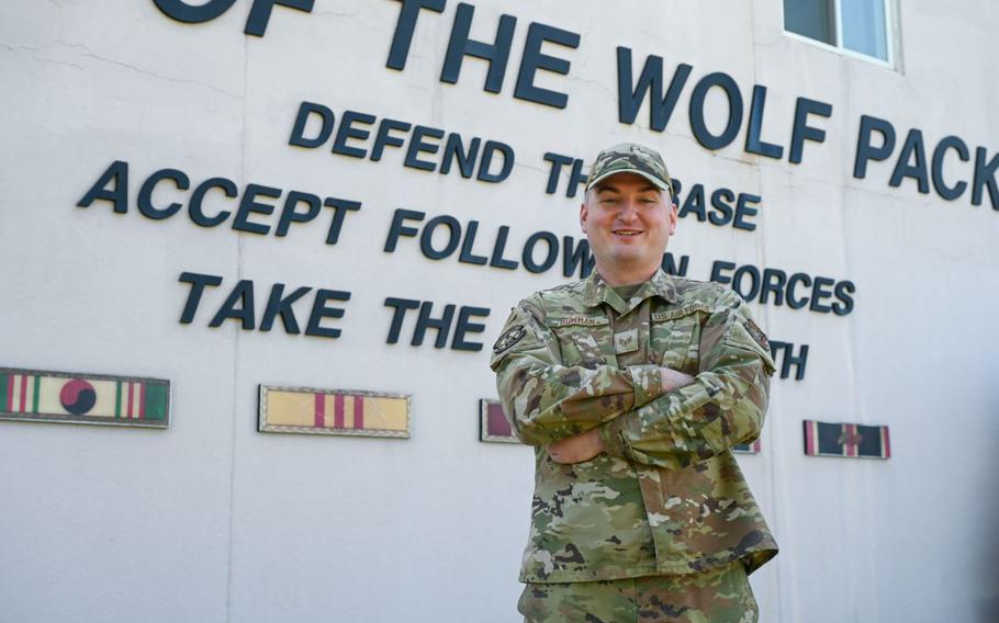 Staff Sgt. Shemuel Bowman poses for a photo outside the 8th Fighter Wing headquarters at Kunsan Air Base.