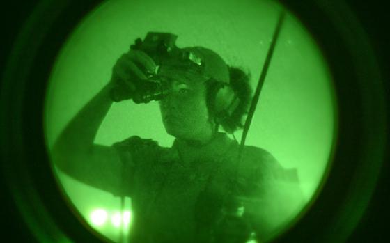 Photo Of U.S. Air Force Tech. Sgt. Kathy Sells, 8th Operational Support Squadron noncommissioned officer in charge of airfield management operations, looks through night vision goggles during helicopter landing zone operations at Kunsan Air Base, Republic of Korea, Sept. 5, 2024. This training highlighted the Air Force’s Mission Ready Airmen development and Kunsan’s ability to accept follow-on forces by directing air operations from non-standard locations on the airfield.